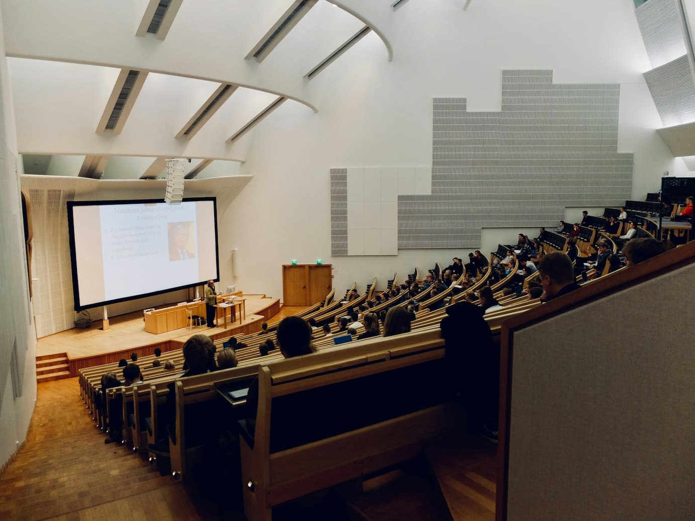Students sitting in a lecture hall.